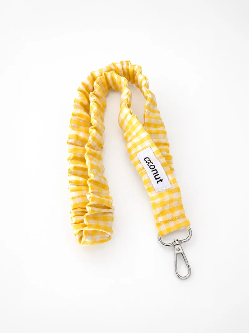 Colgador elástico vichy amarillo